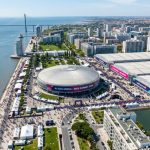 Aerial view of Parque das Nações district in Lisbon with MEO Arena and FIL exhibition centre visible along the waterfront during Web Summit week
